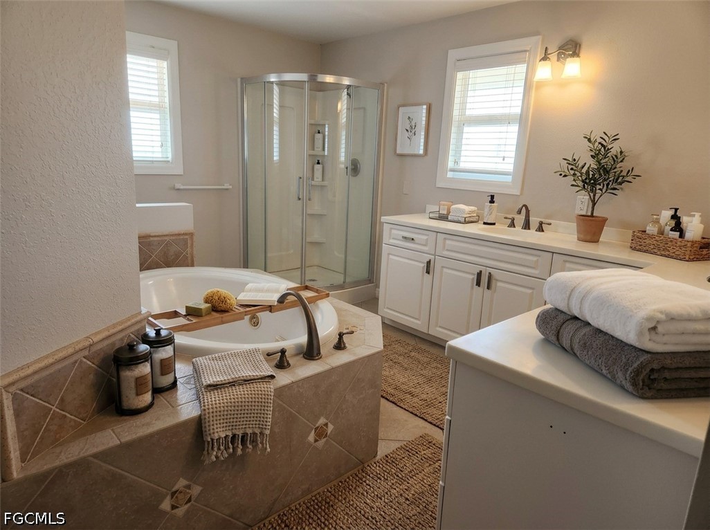 3417 19th Street Southwest Lehigh Acres, FL 33976 - Photo 7 of 14 a spacious bathroom with sink mirror and shower