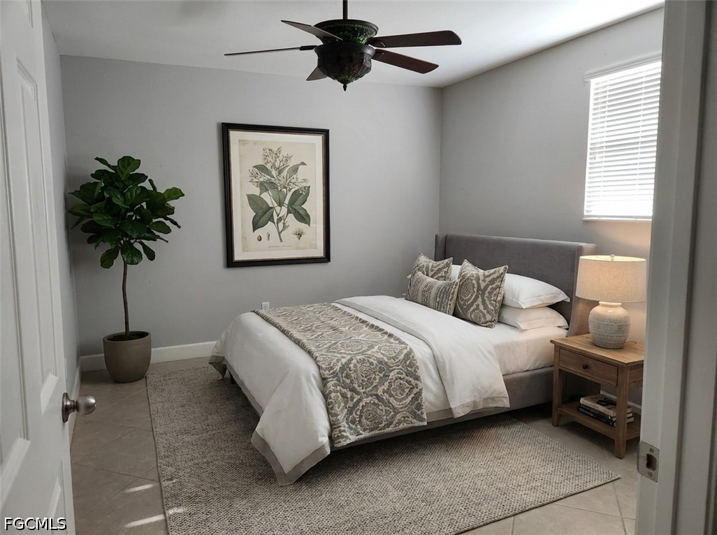 3417 19th Street Southwest Lehigh Acres, FL 33976 - Photo 8 of 14 a bedroom with a bed and a window