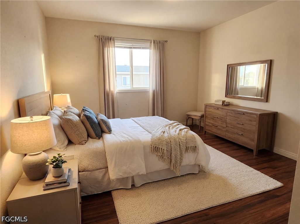 3417 19th Street Southwest Lehigh Acres, FL 33976 - Photo 10 of 14 a bedroom with a bed and window