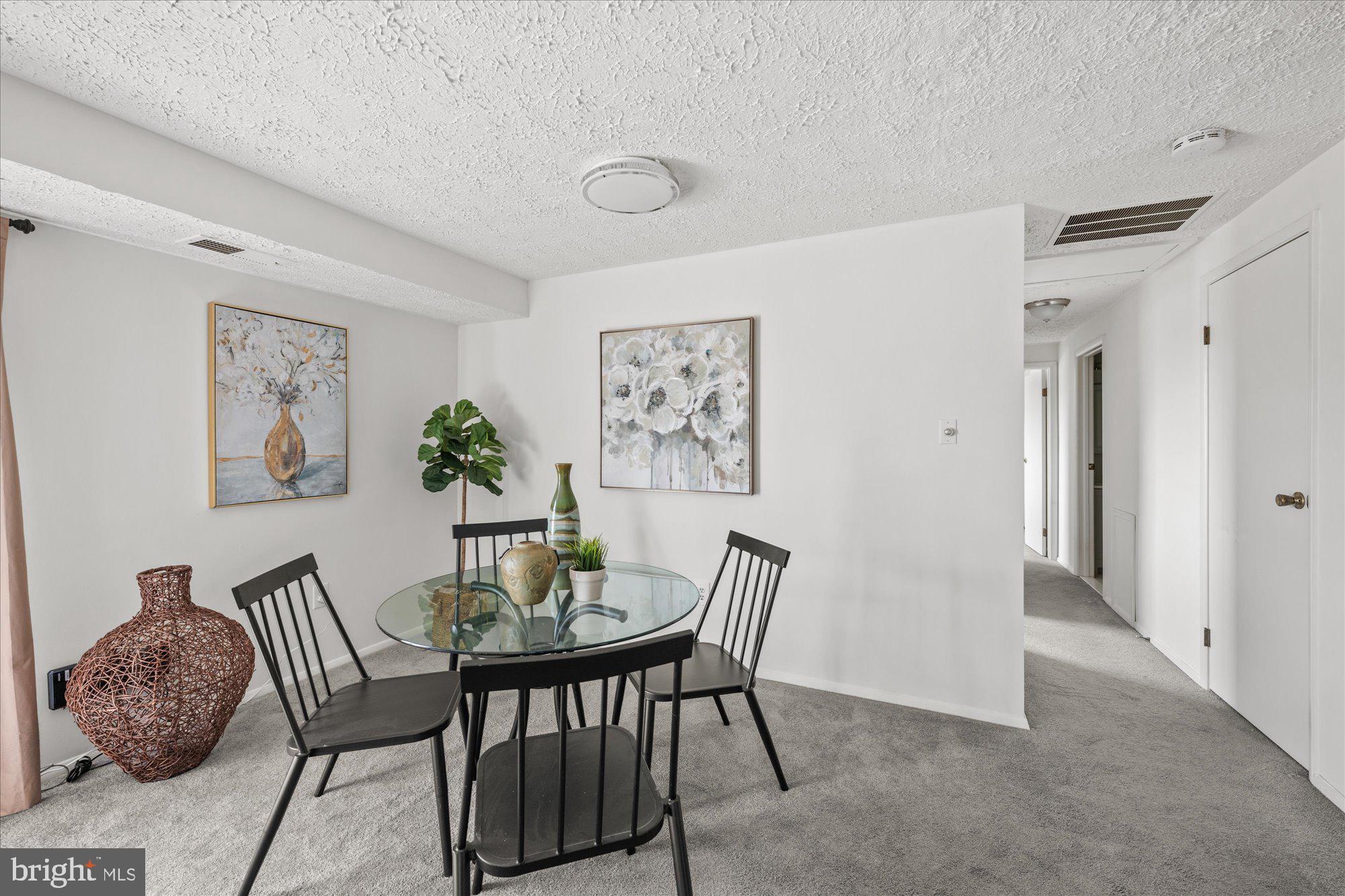 19517 Gunners Branch Road, Unit 431 Germantown, MD 20876 - Photo 11 of 23 a dining room with furniture and window