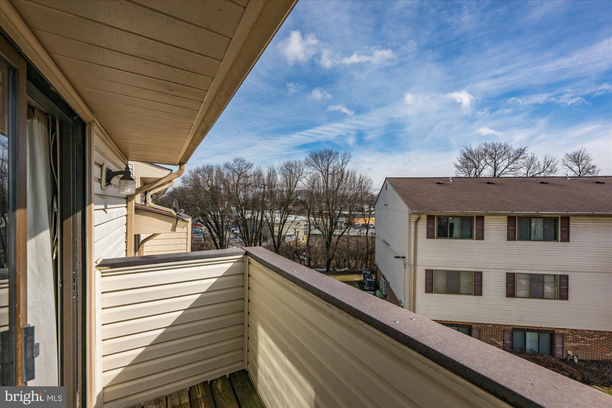 19517 Gunners Branch Road, Unit 431 Germantown, MD 20876 - Photo 12 of 23 a view of a building from a balcony