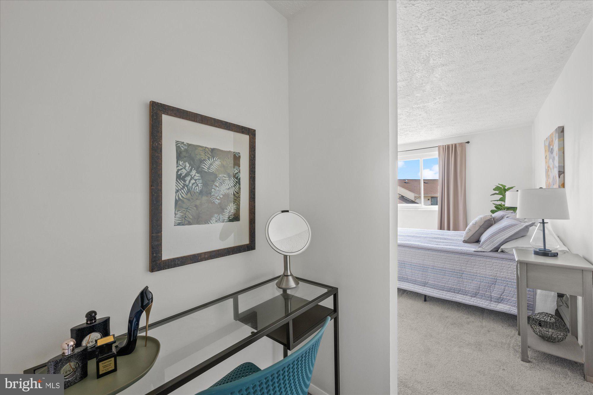 19517 Gunners Branch Road, Unit 431 Germantown, MD 20876 - Photo 16 of 23 a view of a livingroom with furniture and a couch