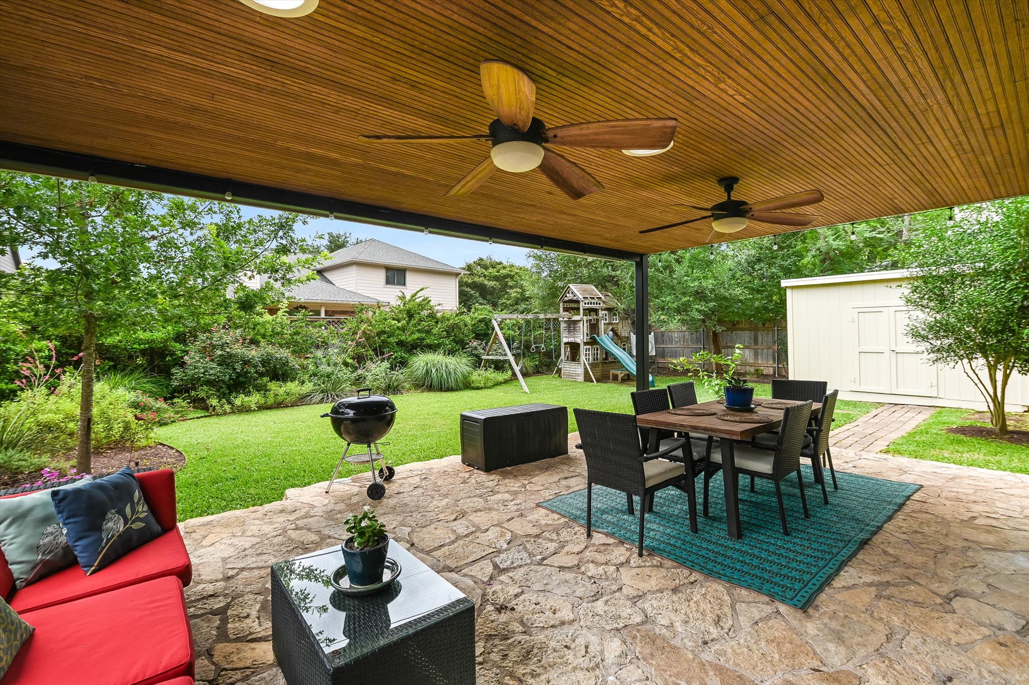 6456 Ruxton Lane Austin, TX 78749 - Photo 24 of 30 Enjoy outdoor living with a spacious stone patio, perfect for grilling and dining al fresco.