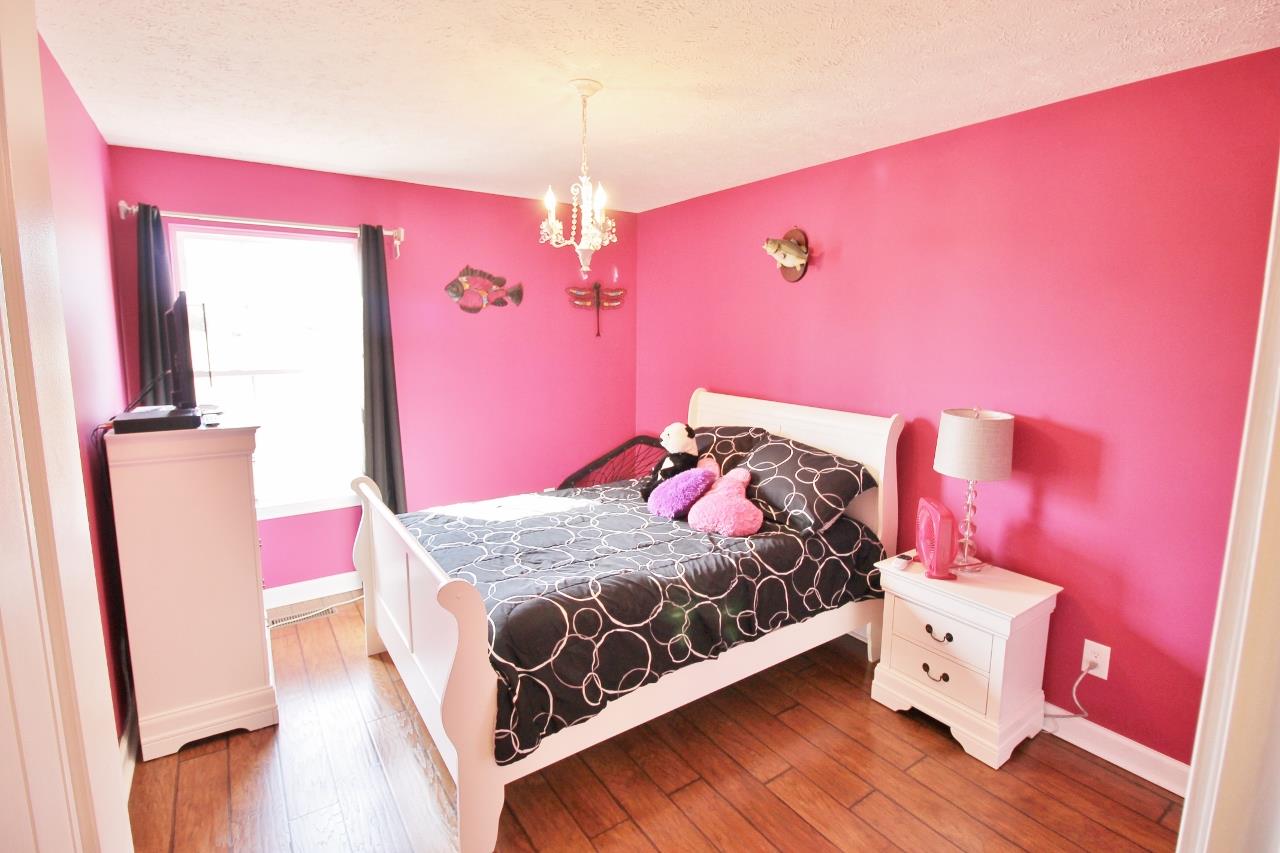 691 Scattersville Road Portland, TN 37148 - Photo 18 of 30 a bed room with a bed and a couch
