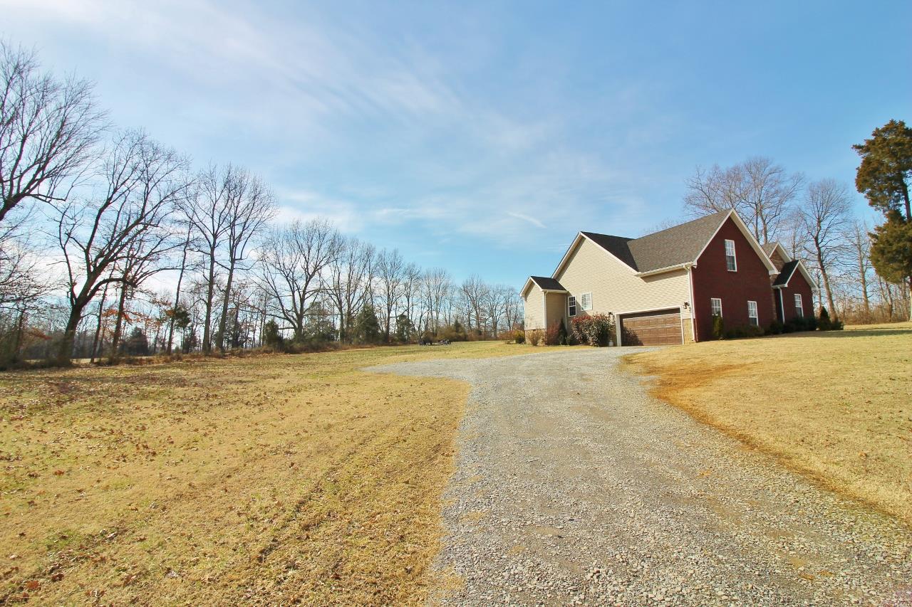 691 Scattersville Road Portland, TN 37148 - Photo 3 of 30 a view of a house with snow on the road