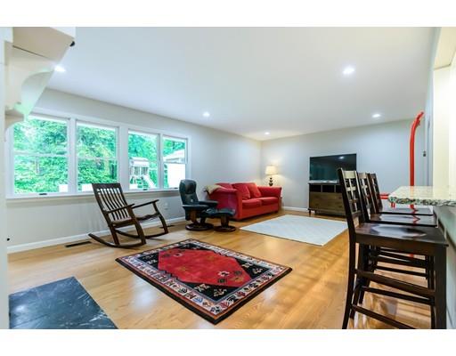 5 Lantern Road Andover, MA 01810 - Photo 7 of 32 a living room with furniture a wooden floor and next to a window