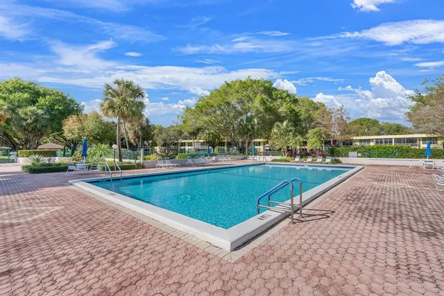 a view of a swimming pool with a patio