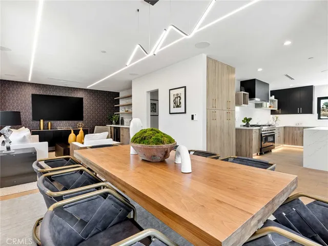 a view of a dining room with furniture and a window