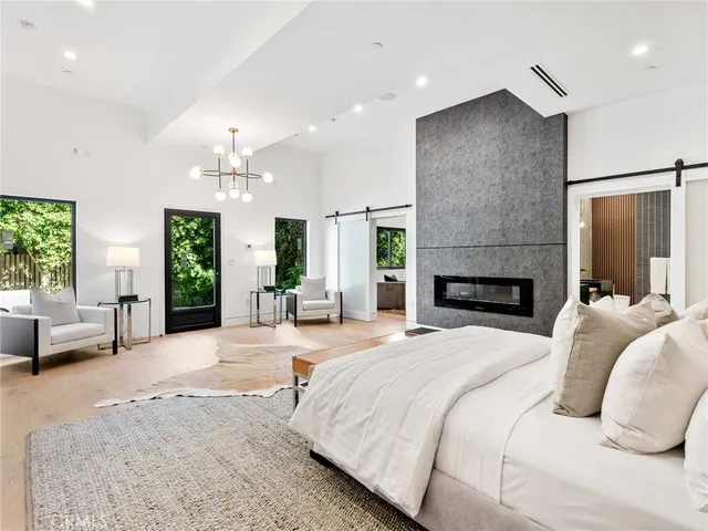 a kitchen with a sink and a stove next to a window