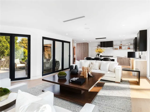 a living room with fireplace furniture and a flat screen tv