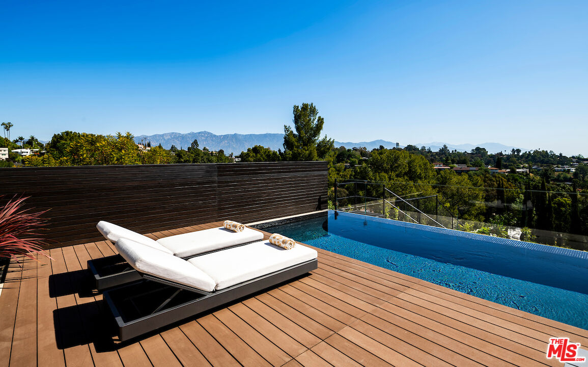 1750 Hanscom Drive South Pasadena, CA 91030 - Photo 3 of 3 a view of a balcony with wooden floor and outdoor seating