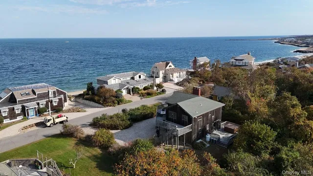 an aerial view of a house with a ocean view