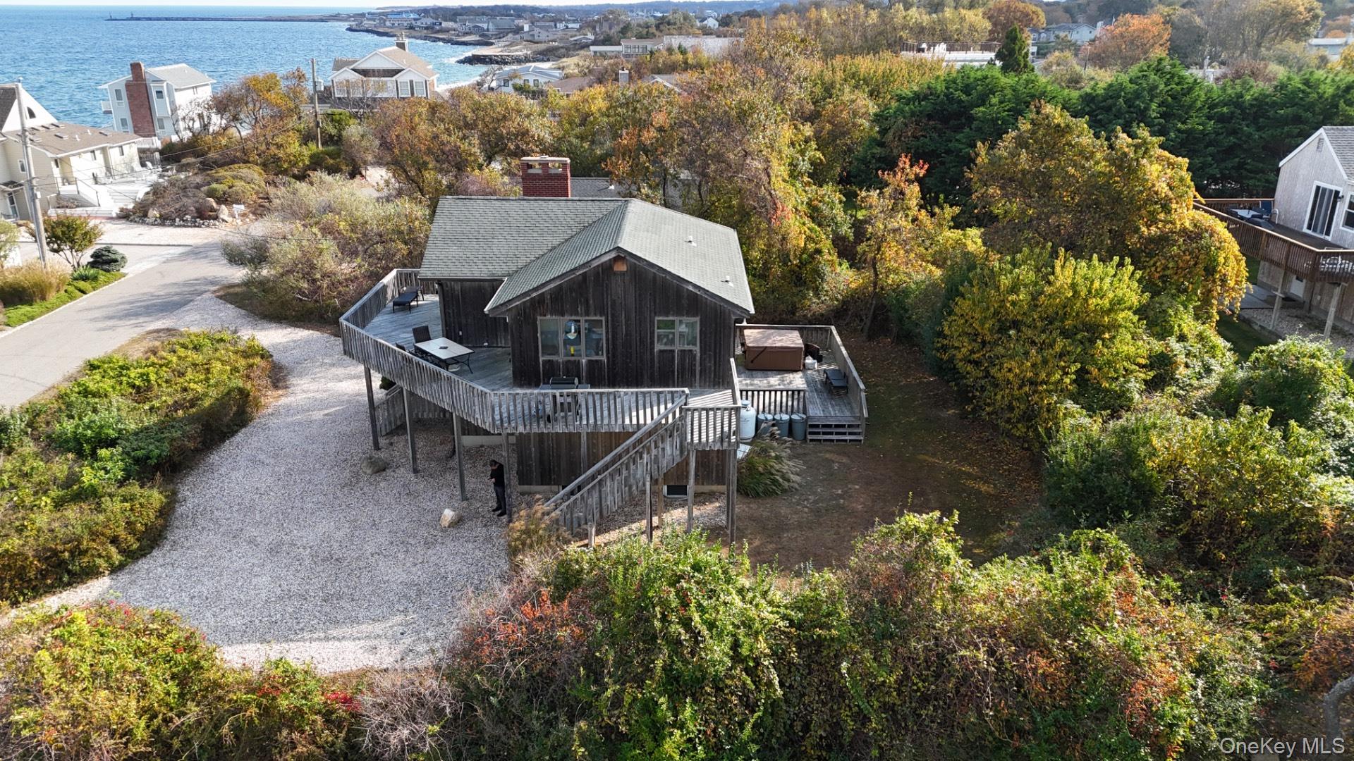 21 Captain Kidds Path Montauk, NY 11954 - Photo 3 of 30 an aerial view of a house with a yard basket ball court and outdoor seating