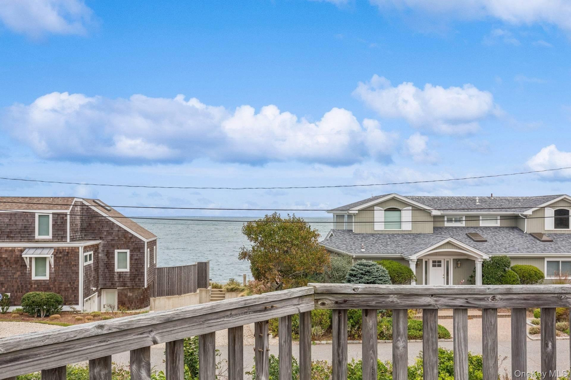 21 Captain Kidds Path Montauk, NY 11954 - Photo 8 of 30 a view of a brick building next to a yard
