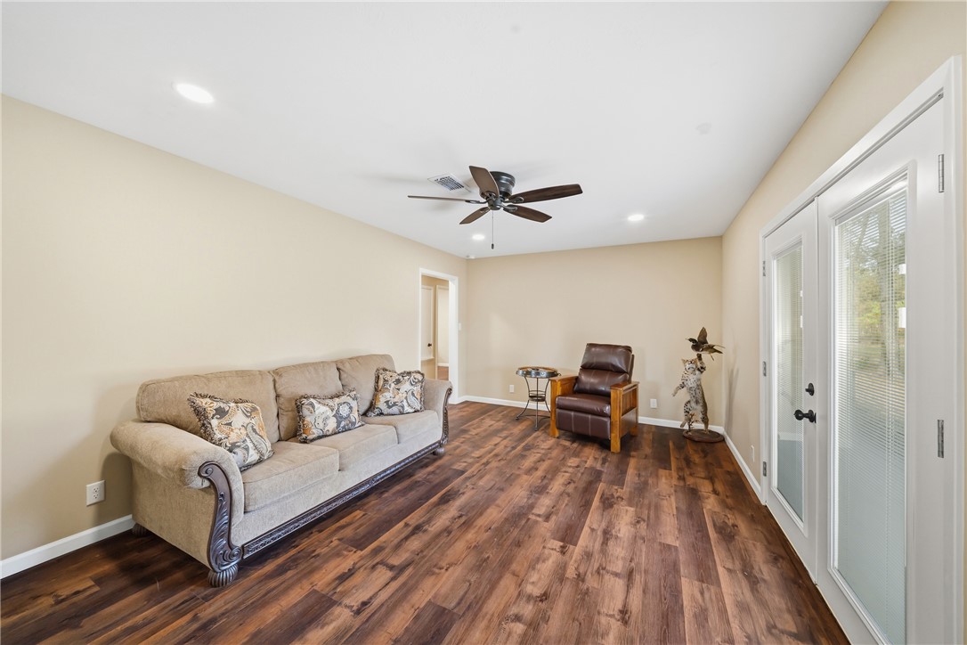 4608 Union Road North Zulch, TX 77872 - Photo 11 of 35 a living room with furniture and a wooden floor
