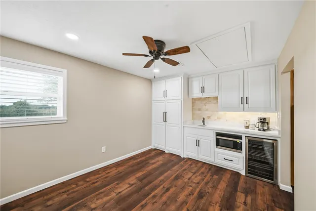 a kitchen with stainless steel appliances a stove a sink and a refrigerator