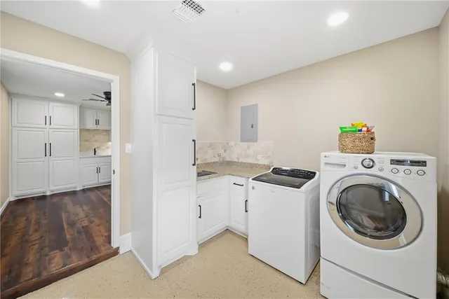 a view of storage and utility room with washer and dryer