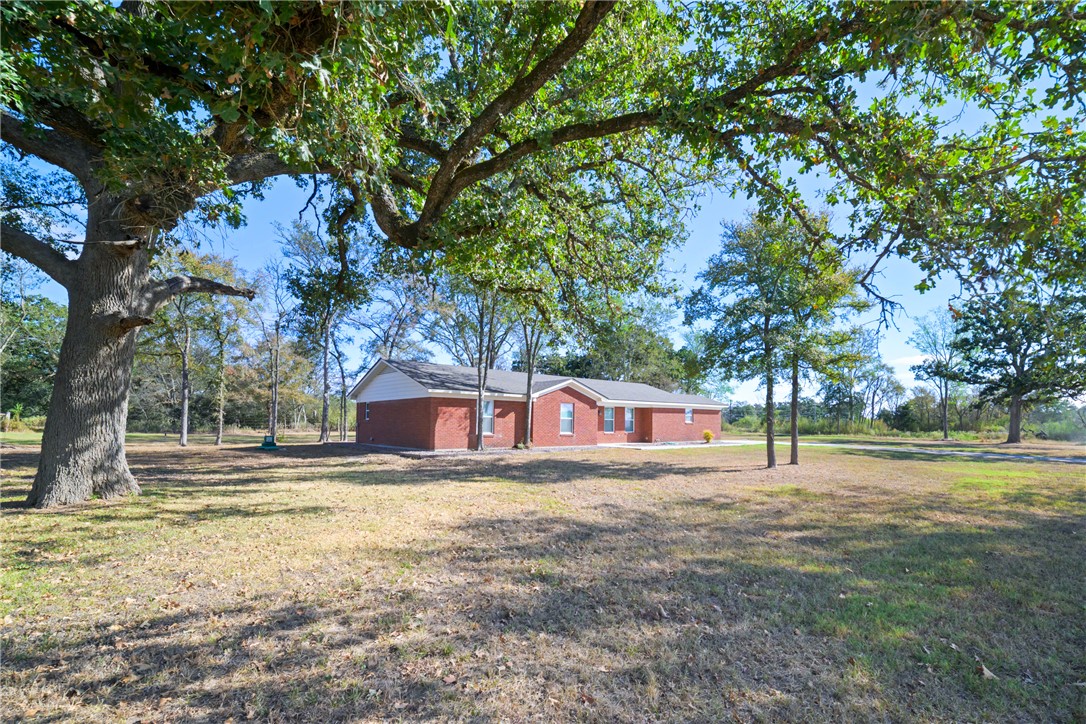 4608 Union Road North Zulch, TX 77872 - Photo 33 of 35 a view of swimming pool with trees in the background