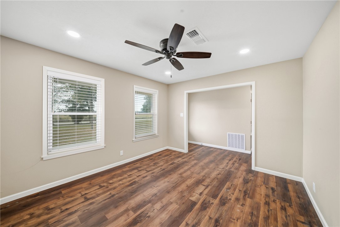 4608 Union Road North Zulch, TX 77872 - Photo 8 of 35 a view of an empty room with a window and a kitchen