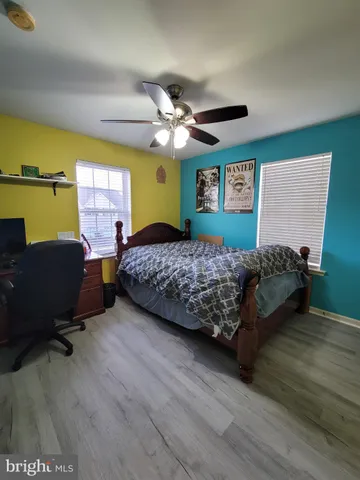 a bedroom with a bed and furniture