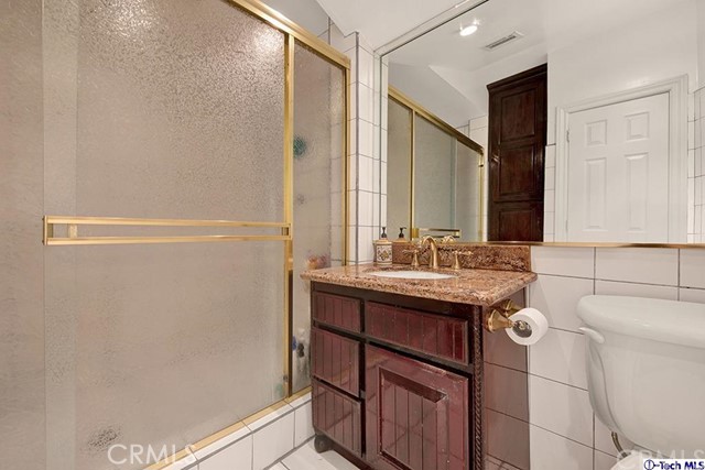 2086 Maiden Lane Altadena, CA 91001 - Photo 11 of 21 a bathroom with a sink a toilet and a mirror
