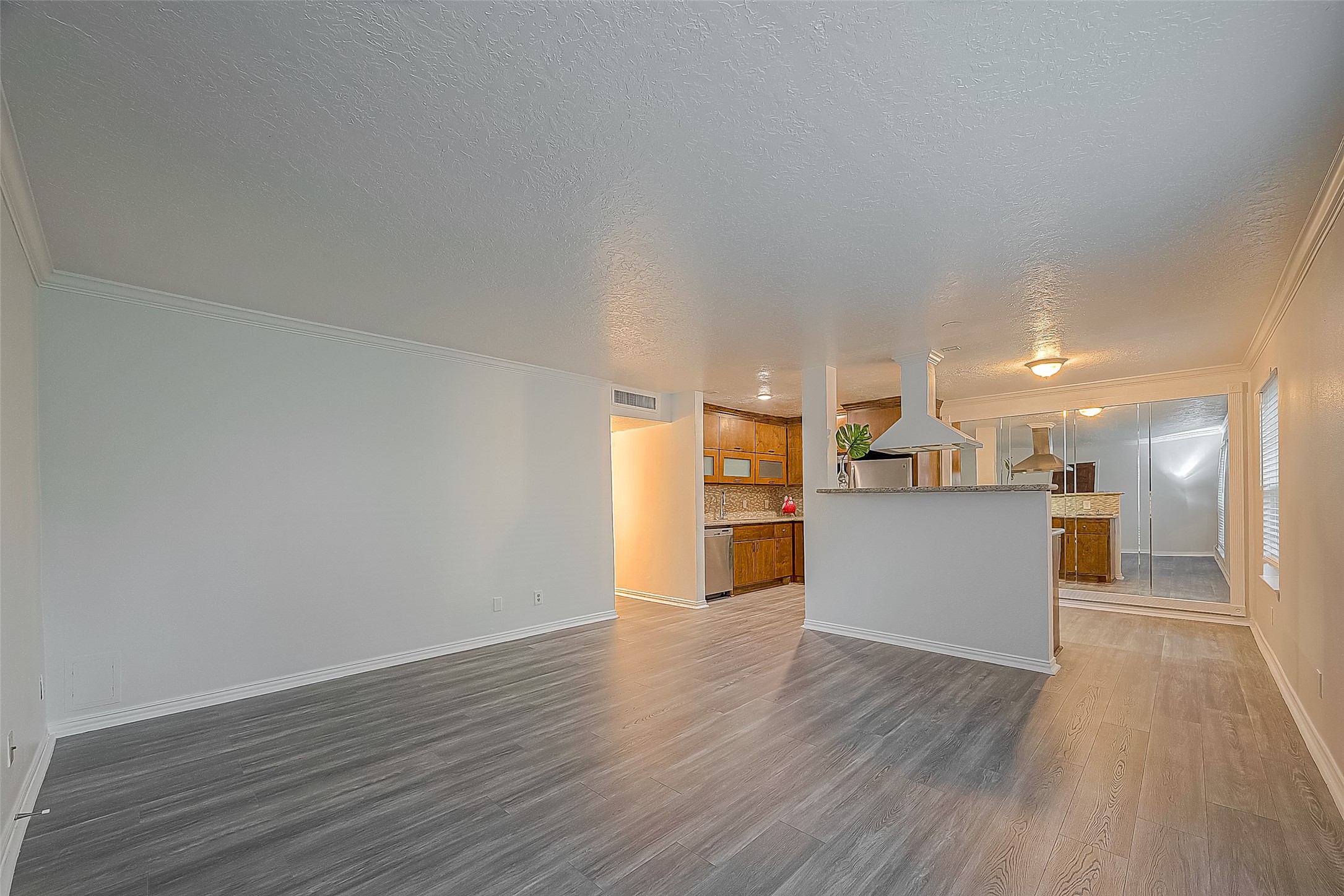 3224 Timmons Lane, Unit 147 Houston, TX 77027 - Photo 13 of 32 a view of a kitchen with wooden floor