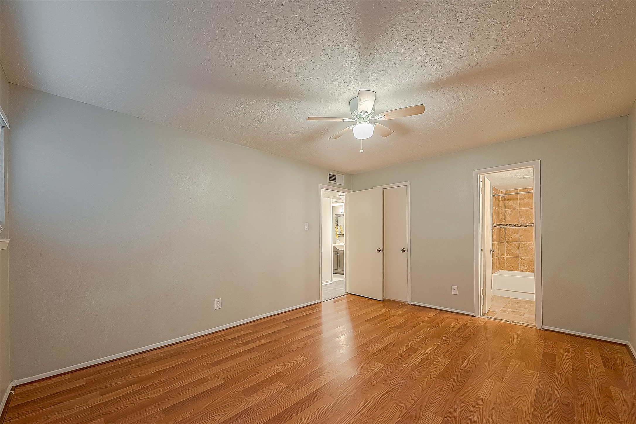 3224 Timmons Lane, Unit 147 Houston, TX 77027 - Photo 16 of 32 a view of an empty room with wooden floor