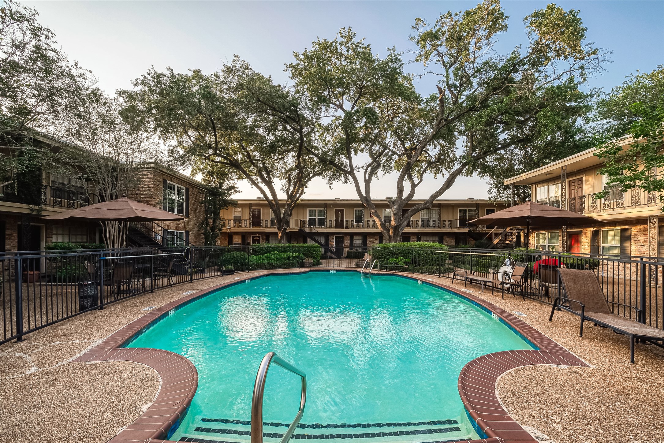 3224 Timmons Lane, Unit 147 Houston, TX 77027 - Photo 27 of 32 an outdoor space with swimming pool and furniture