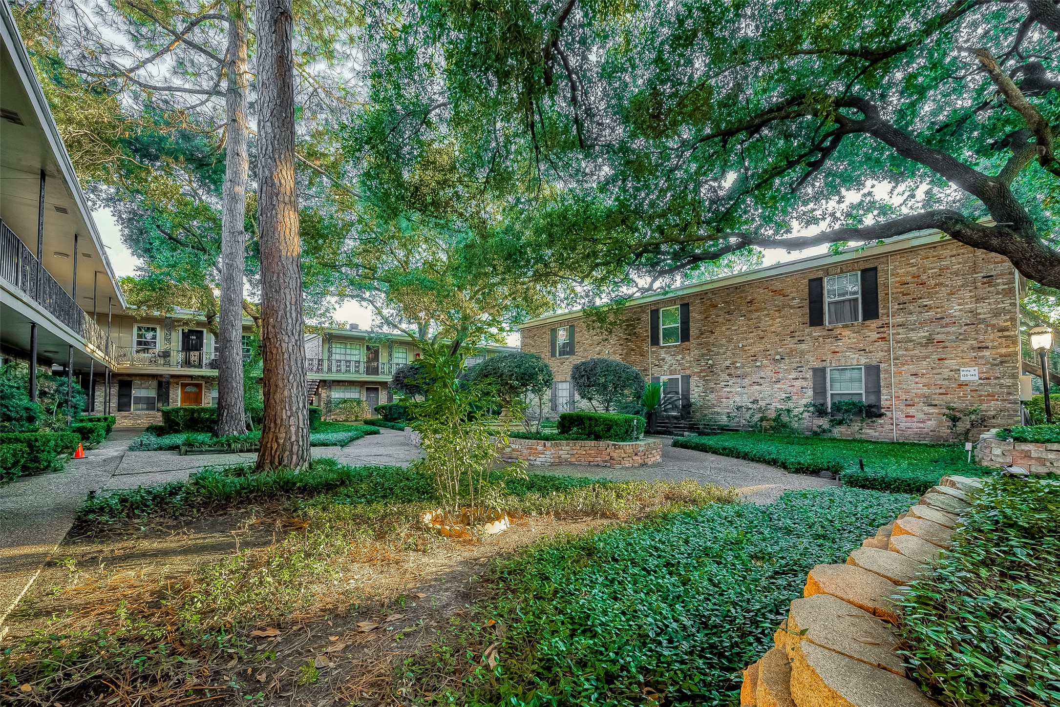 3224 Timmons Lane, Unit 147 Houston, TX 77027 - Photo 32 of 32 a front view of a house with a yard