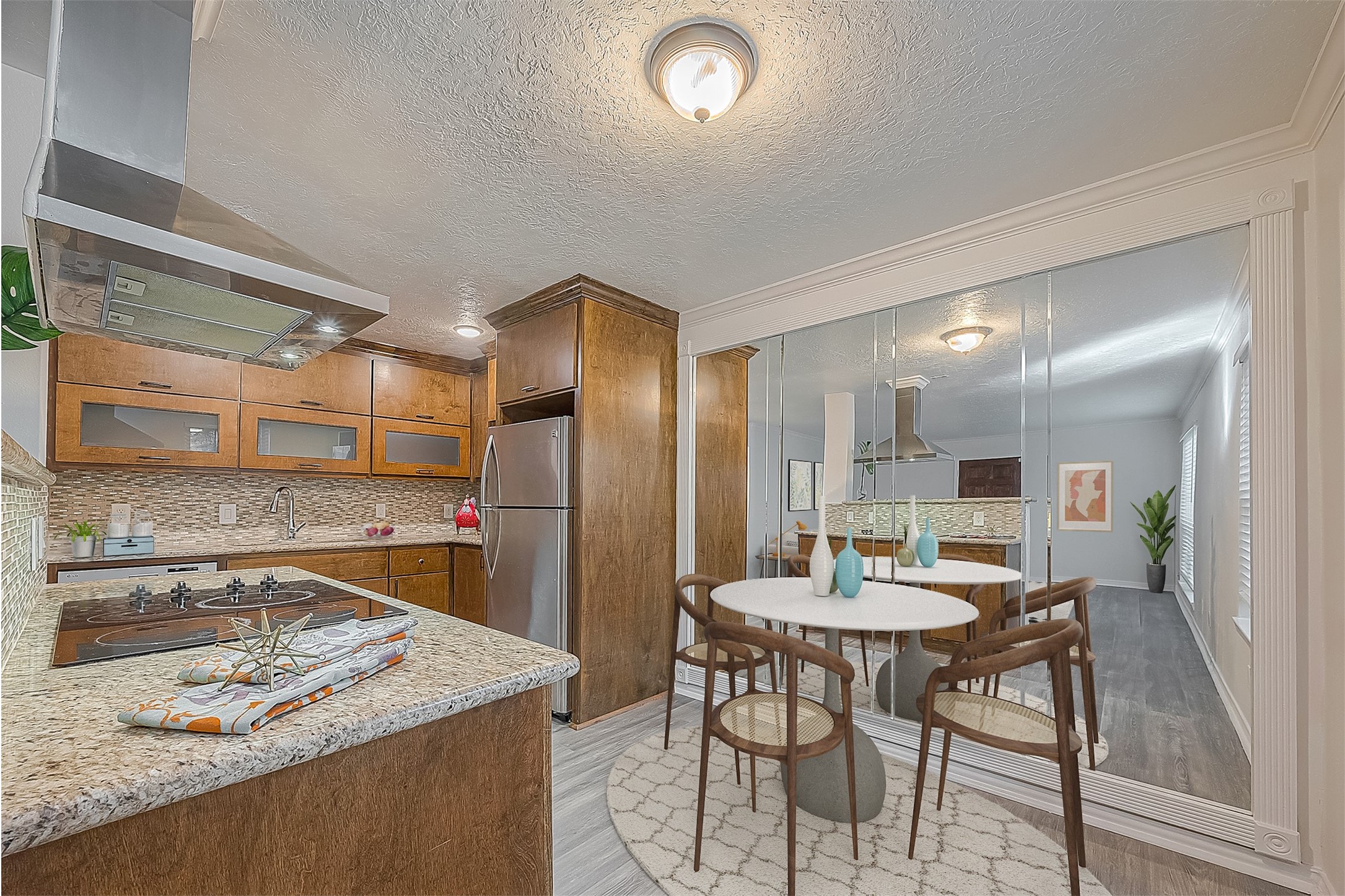 3224 Timmons Lane, Unit 147 Houston, TX 77027 - Photo 6 of 32 a kitchen with a table and chairs in it