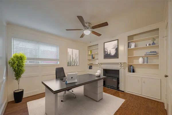 a workspace with furniture window and wooden floor