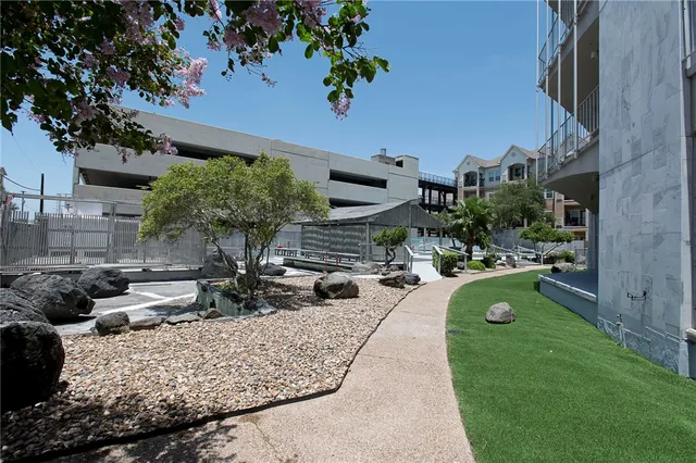 a view of swimming pool with outdoor seating and plants