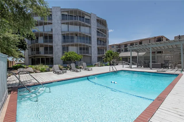 a view of house with outdoor space and swimming pool