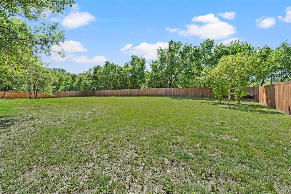200 Clayton Crossing Springtown, TX 76082 - Photo 35 of 40 a view of a field with an trees in the background