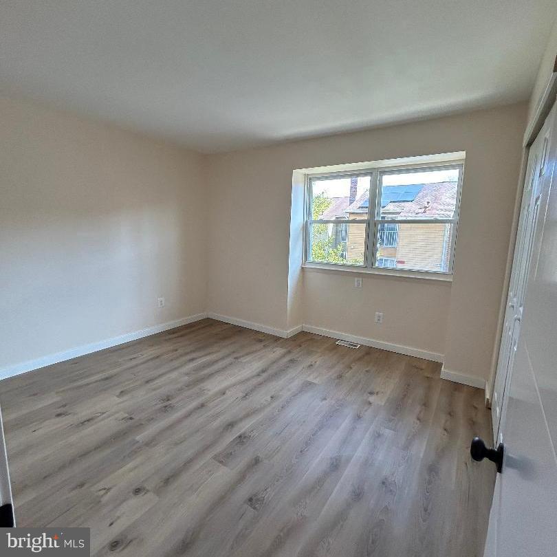 80 Via Cascata Drive Clementon, NJ 08021 - Photo 18 of 26 an empty room with wooden floor and windows