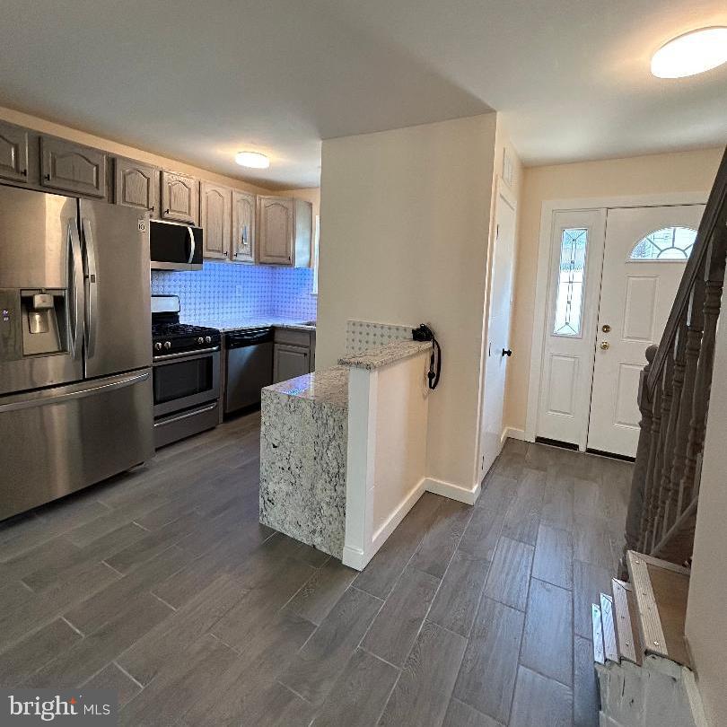 80 Via Cascata Drive Clementon, NJ 08021 - Photo 5 of 26 a kitchen with a refrigerator and a sink