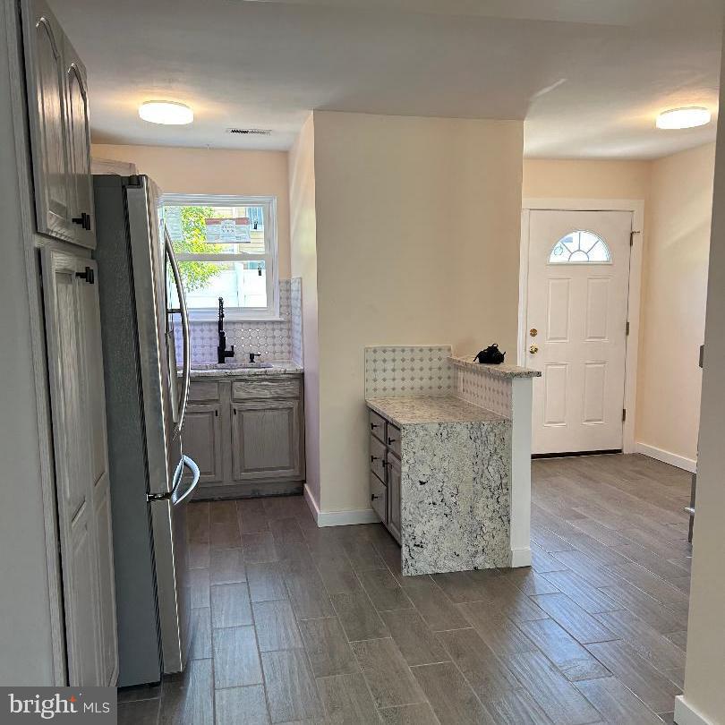 80 Via Cascata Drive Clementon, NJ 08021 - Photo 6 of 26 a room with a washer dryer and wooden floor