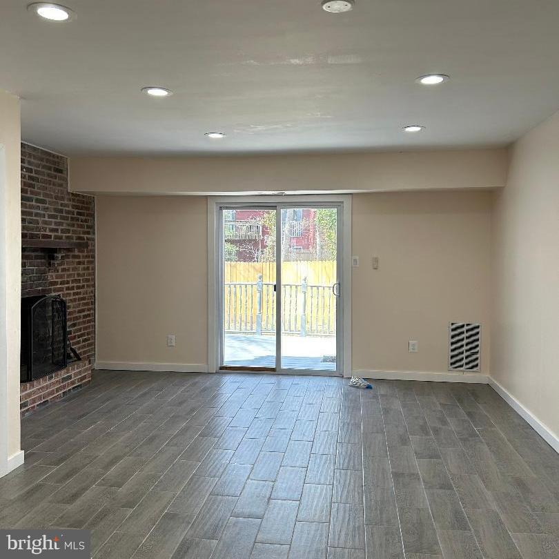 80 Via Cascata Drive Clementon, NJ 08021 - Photo 7 of 26 an empty room with wooden floor and windows