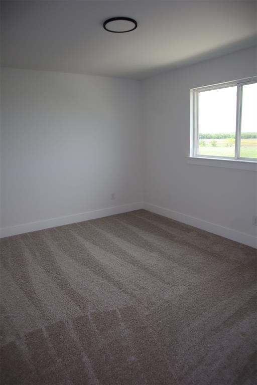 205 Chestnut Celina, TX 75009 - Photo 13 of 17 an empty room with a window