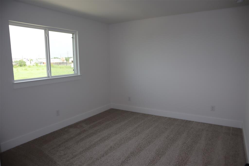 205 Chestnut Celina, TX 75009 - Photo 16 of 17 an empty room with a window