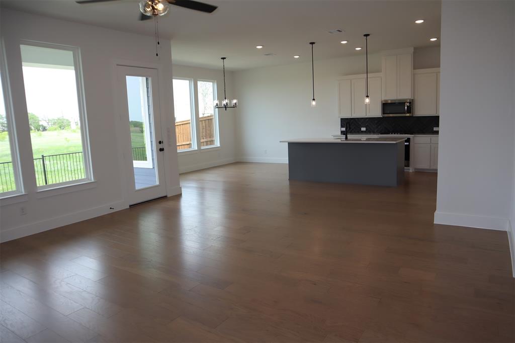205 Chestnut Celina, TX 75009 - Photo 5 of 17 a view of a kitchen with a stove and a window