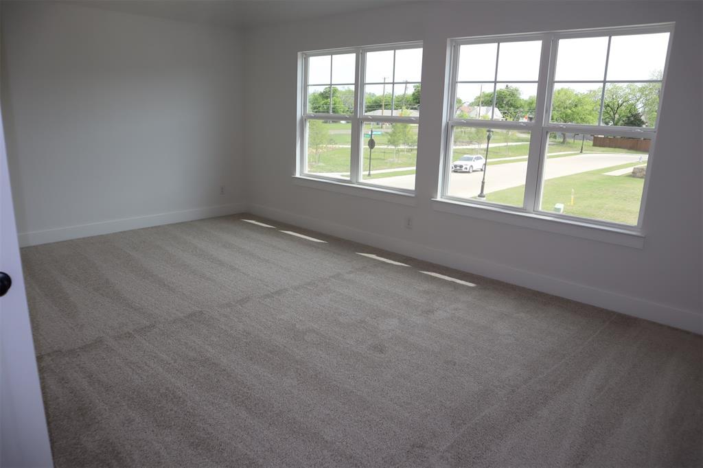205 Chestnut Celina, TX 75009 - Photo 7 of 17 an empty room with a window