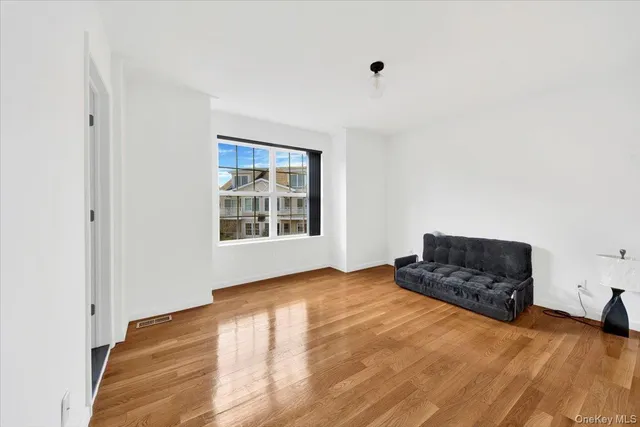 a living room with a couch and a window