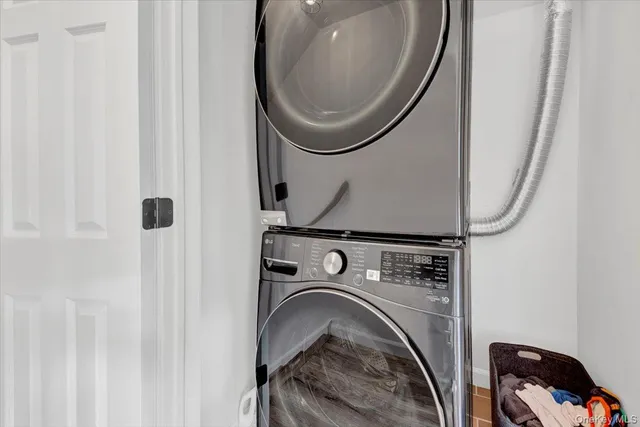 a living room with a bed and a window