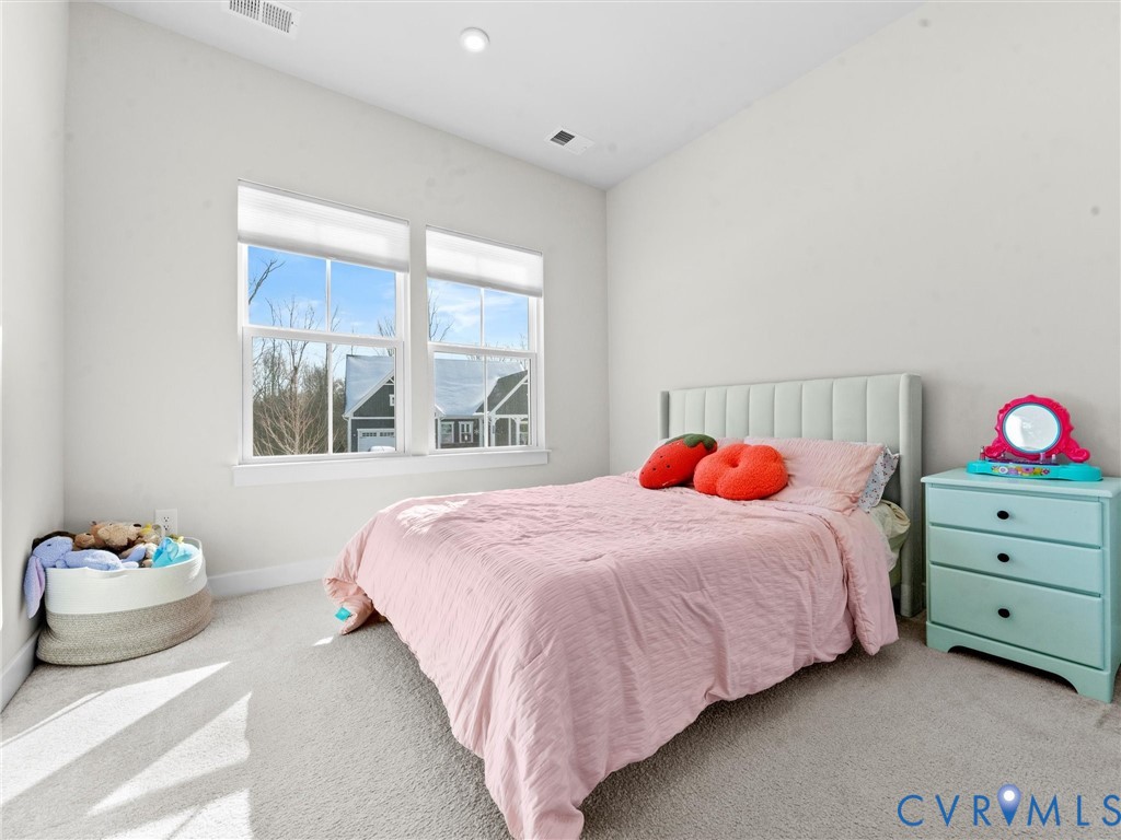 6230 Sheehan Crossing Moseley, VA 23120 - Photo 19 of 32 a bedroom with a bed and a window