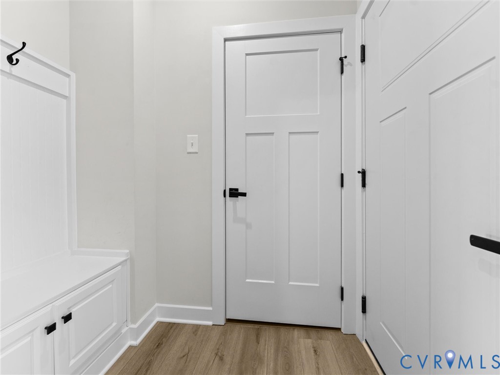 6230 Sheehan Crossing Moseley, VA 23120 - Photo 20 of 32 a view of a hallway with wooden floor