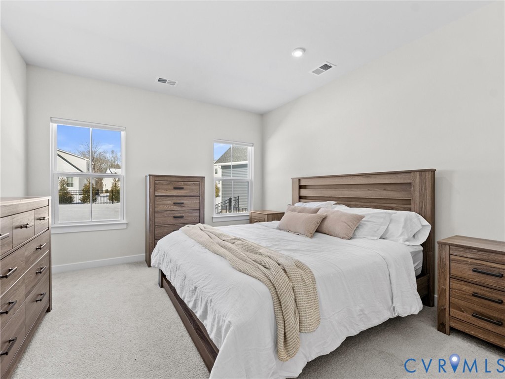 6230 Sheehan Crossing Moseley, VA 23120 - Photo 22 of 32 a bedroom with a bed and dresser