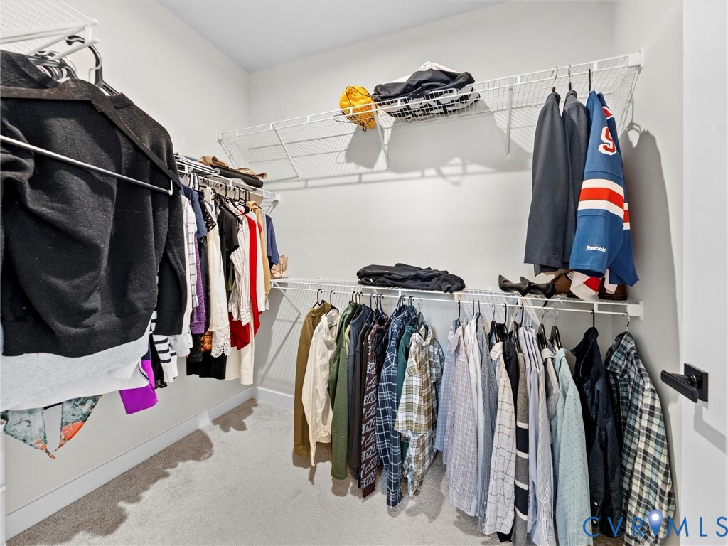 6230 Sheehan Crossing Moseley, VA 23120 - Photo 28 of 32 a view of walk in closet with clothes and shoes
