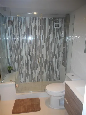 a bathroom with a toilet a sink and bathtub