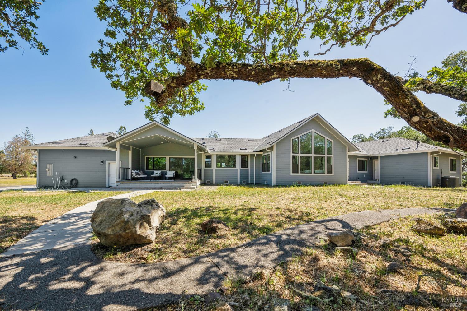 4665 Upper Ridge Road Santa Rosa, CA 95404 - Photo 42 of 71 a front view of a house with a yard